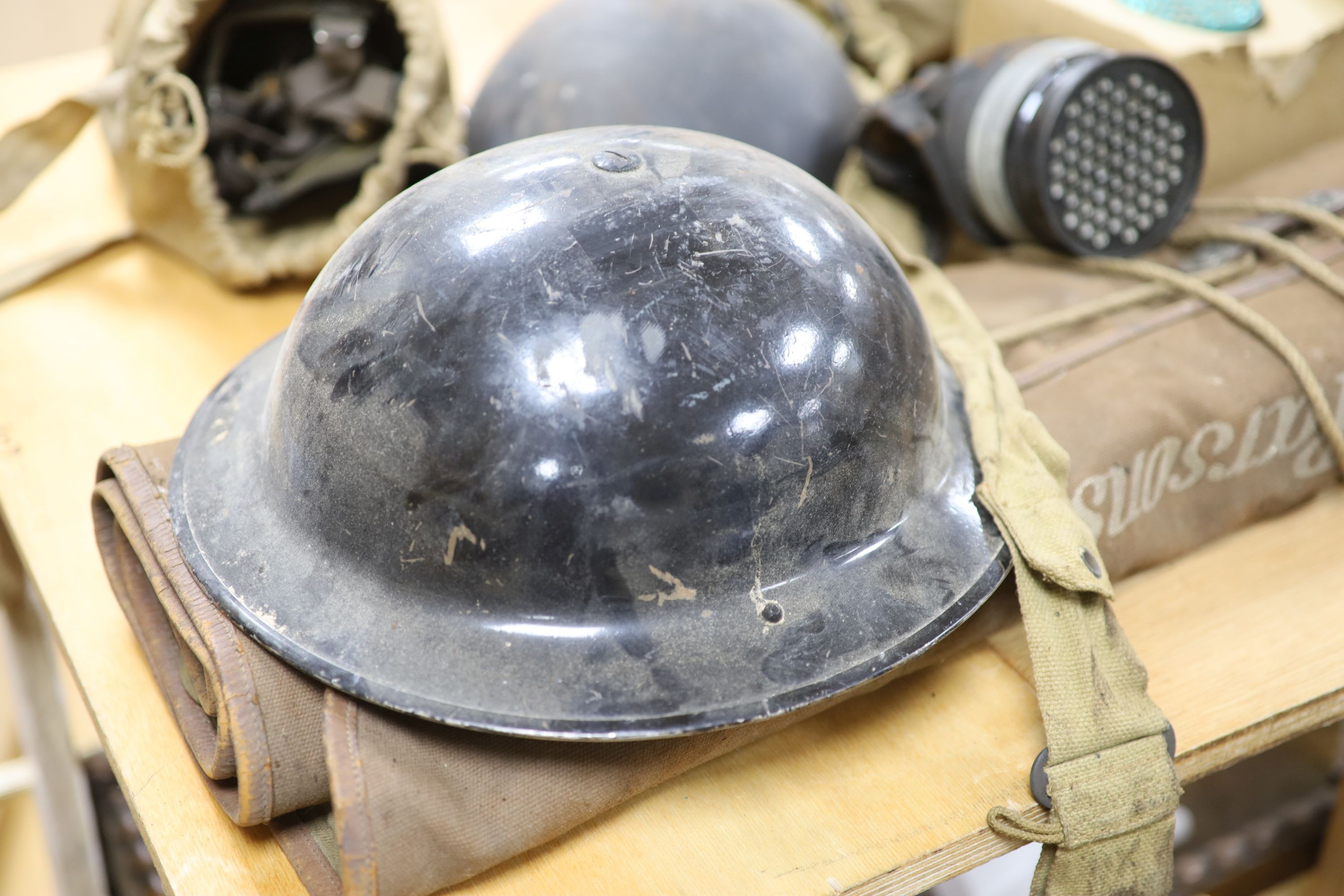 Two WWII air wardens helmets, and other WWII ephemera